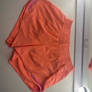 Lululemon Hotty Hot 4” coral-pink color size 6